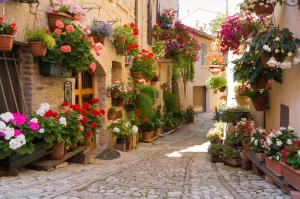 Alley with flowers in Spello, Umbria, Italy