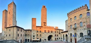 Panoramic view of famous Piazza del Duomo in San Gimignano at sunset, Tuscany, Italy