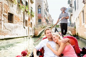 Romantic honeymooners sailing in a Gondola in Venice, Italy
